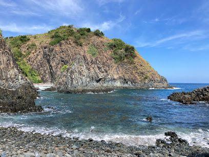 Nestled at the eastern end of Selong Belanak's southern coastline, Semeti Beach (Pantai Semeti) is a secluded gem celebrated for its dramatic volcanic rock formations, striking cliffside scenery, and crystal-clear turquoise waters